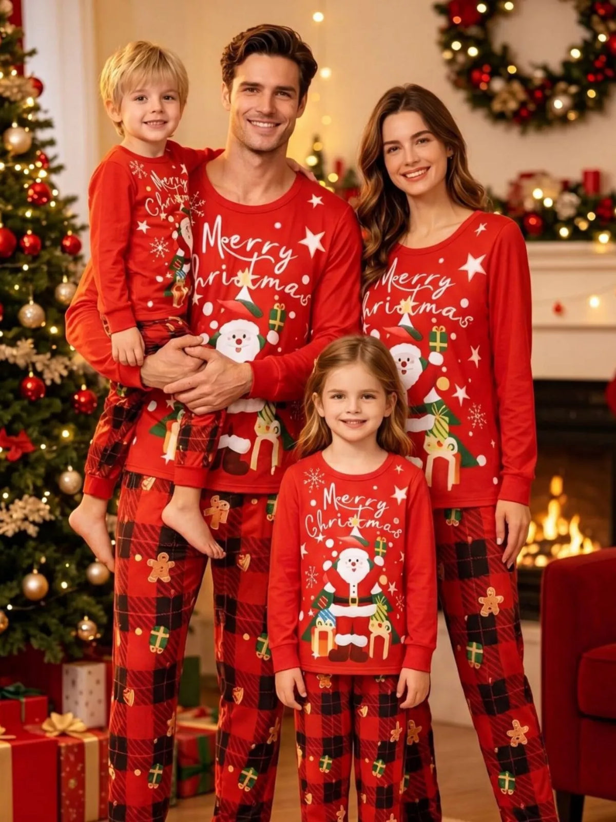 Adults and children wearing red Christmas graphic tops and plaid pants.