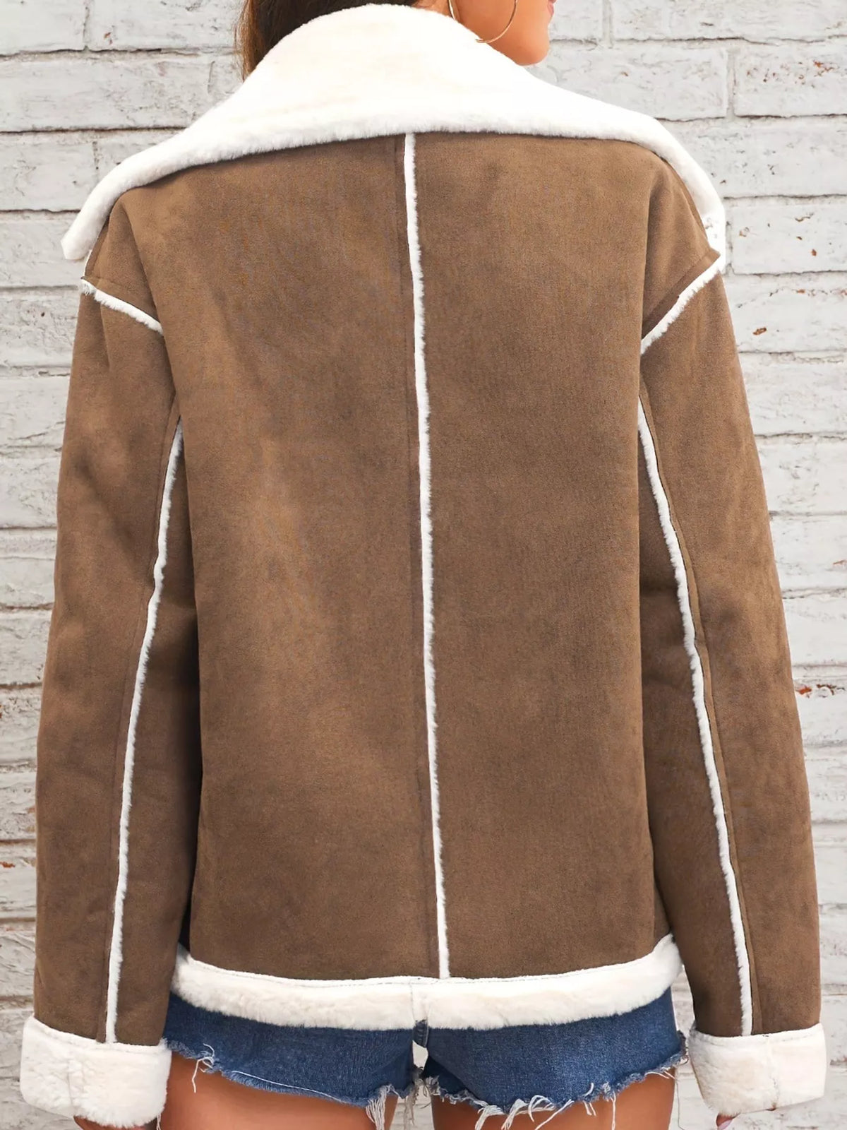 Brown jacket with wide white plush lapels, contrast trim and front pockets, back view.