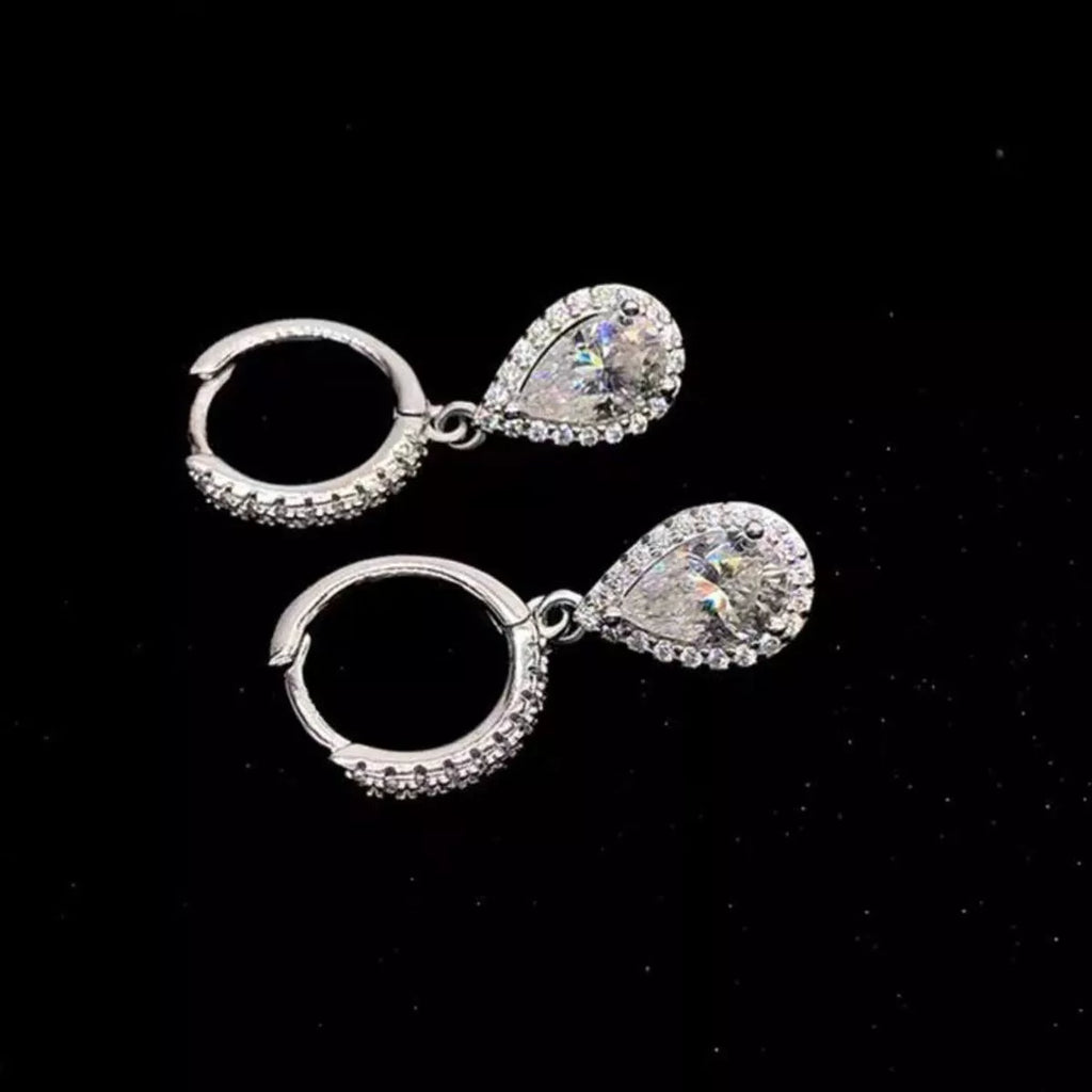 Silver-tone hoop earrings with teardrop halo stone drops — detail view