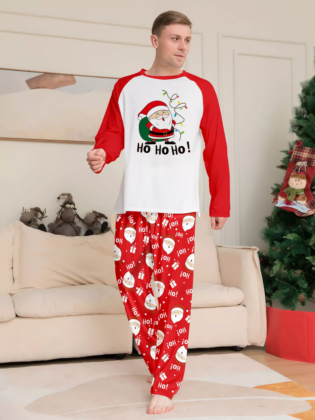 Front view of the men's red-and-white Santa graphic pajama set.