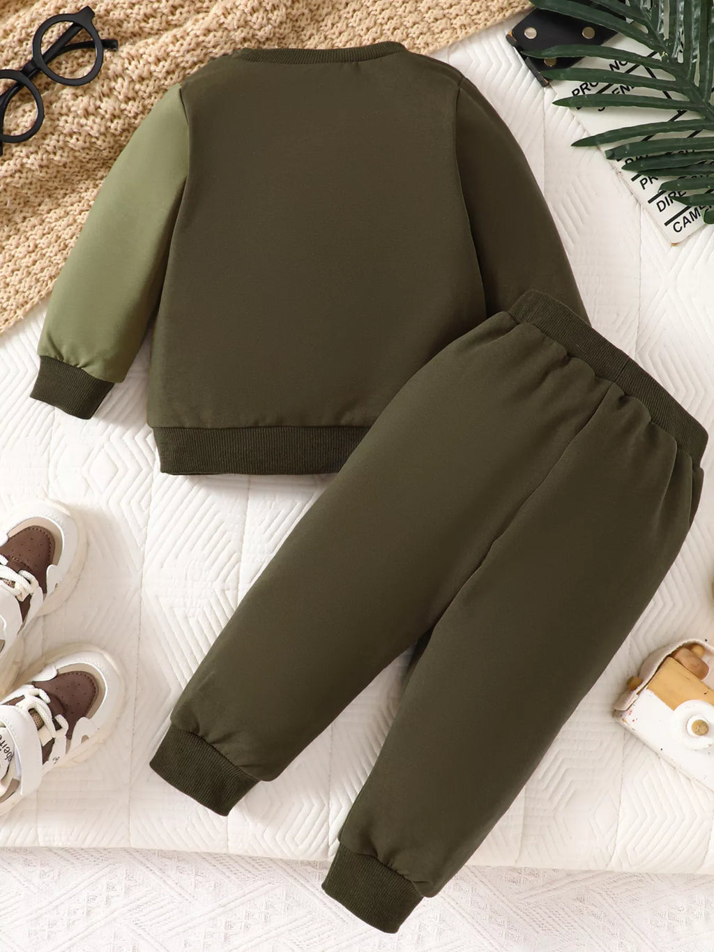 Olive, black and orange color-block sweatshirt and matching joggers laid flat
