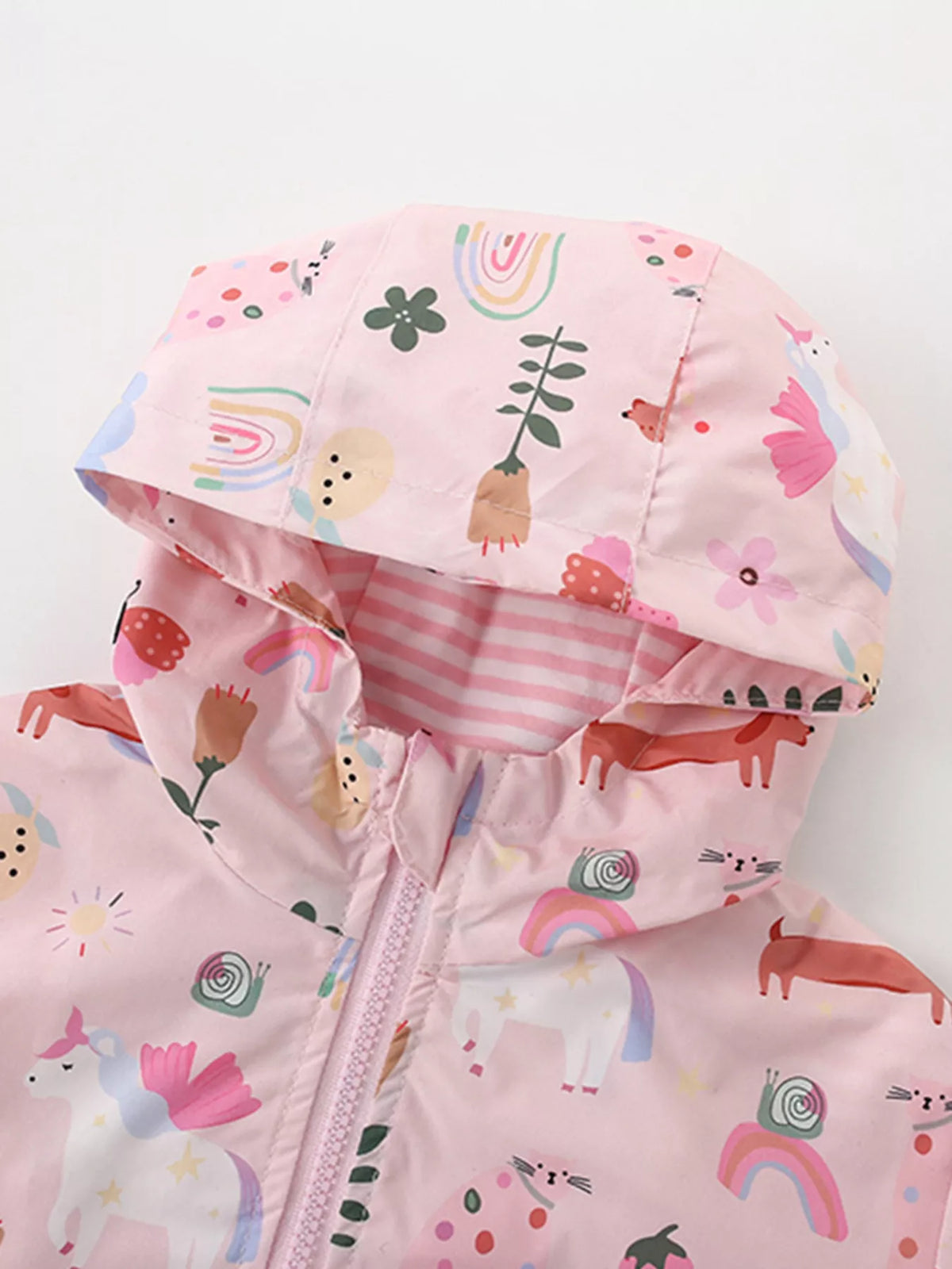 Close-up of the pink printed jacket's hood and striped lining.