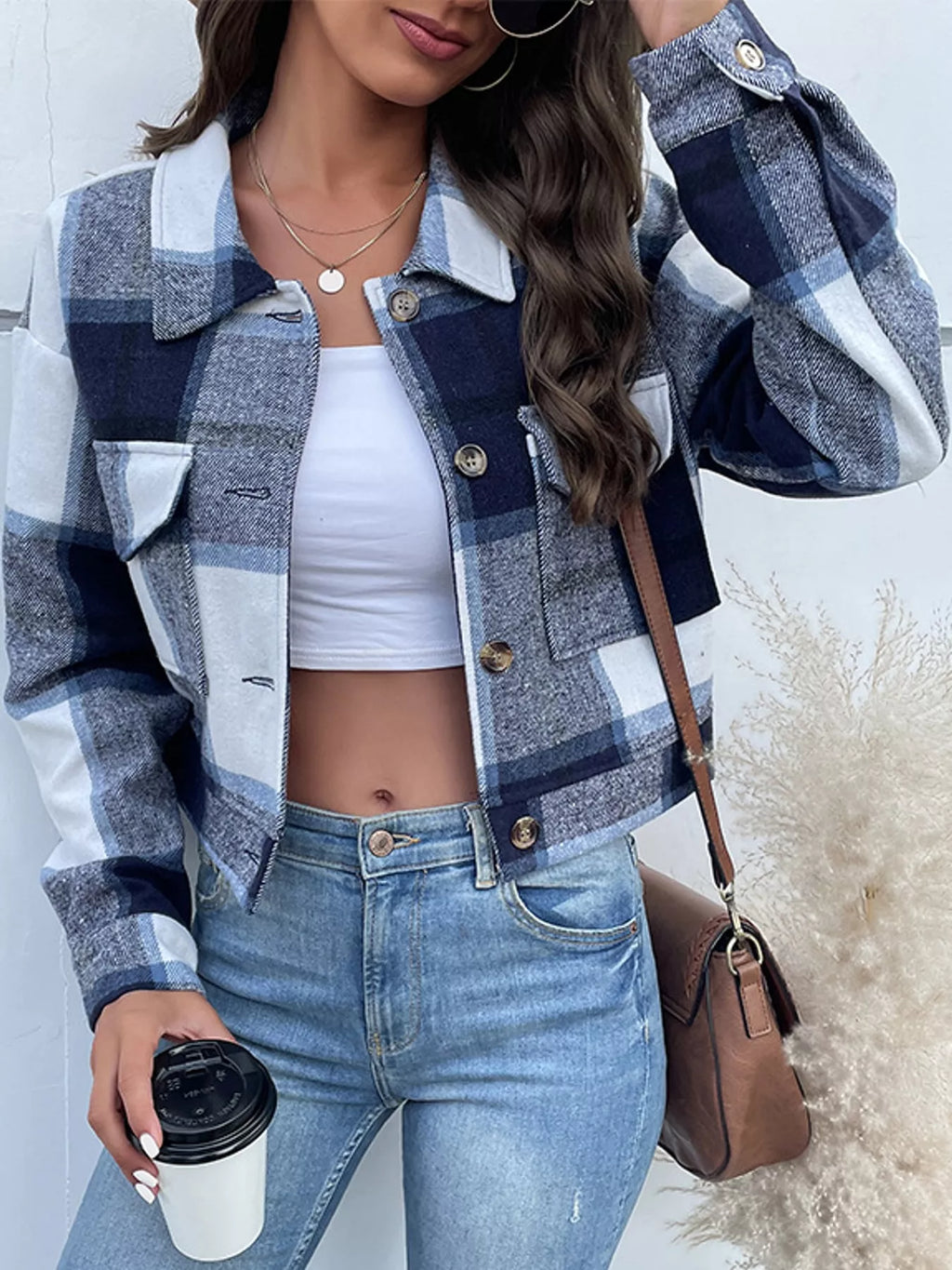 Navy color-block plaid cropped jacket with flap chest pockets, front view.