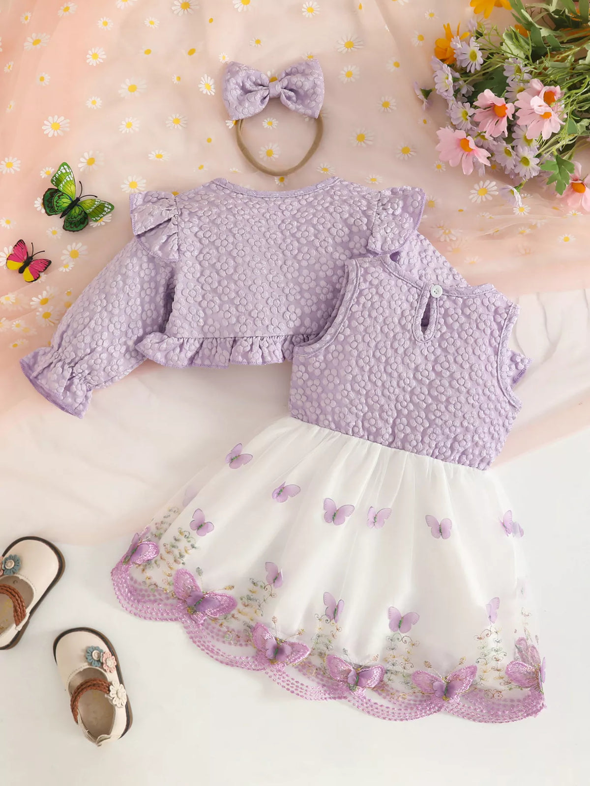 Back flat lay of the lavender jacket and vest with white floral-trimmed tulle skirt.