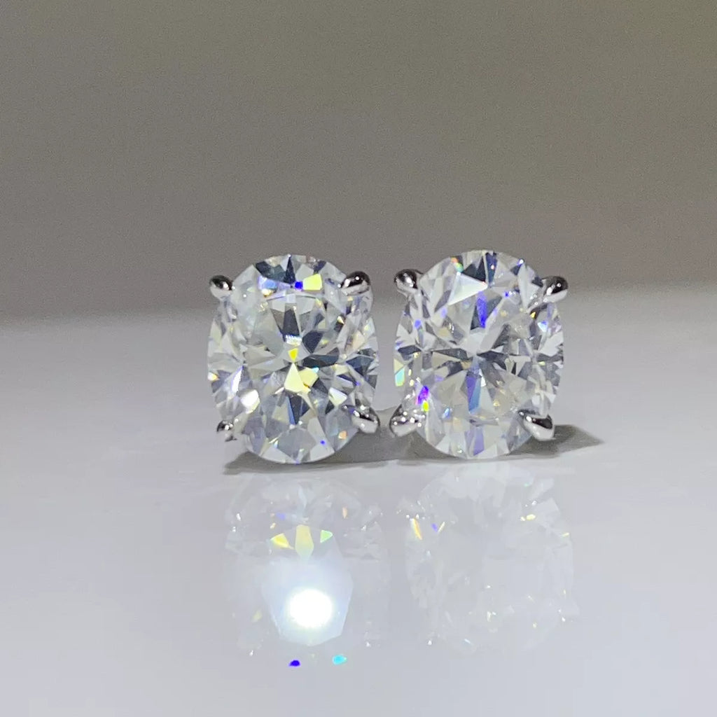 Silver-tone round clear stone stud earrings — detail view