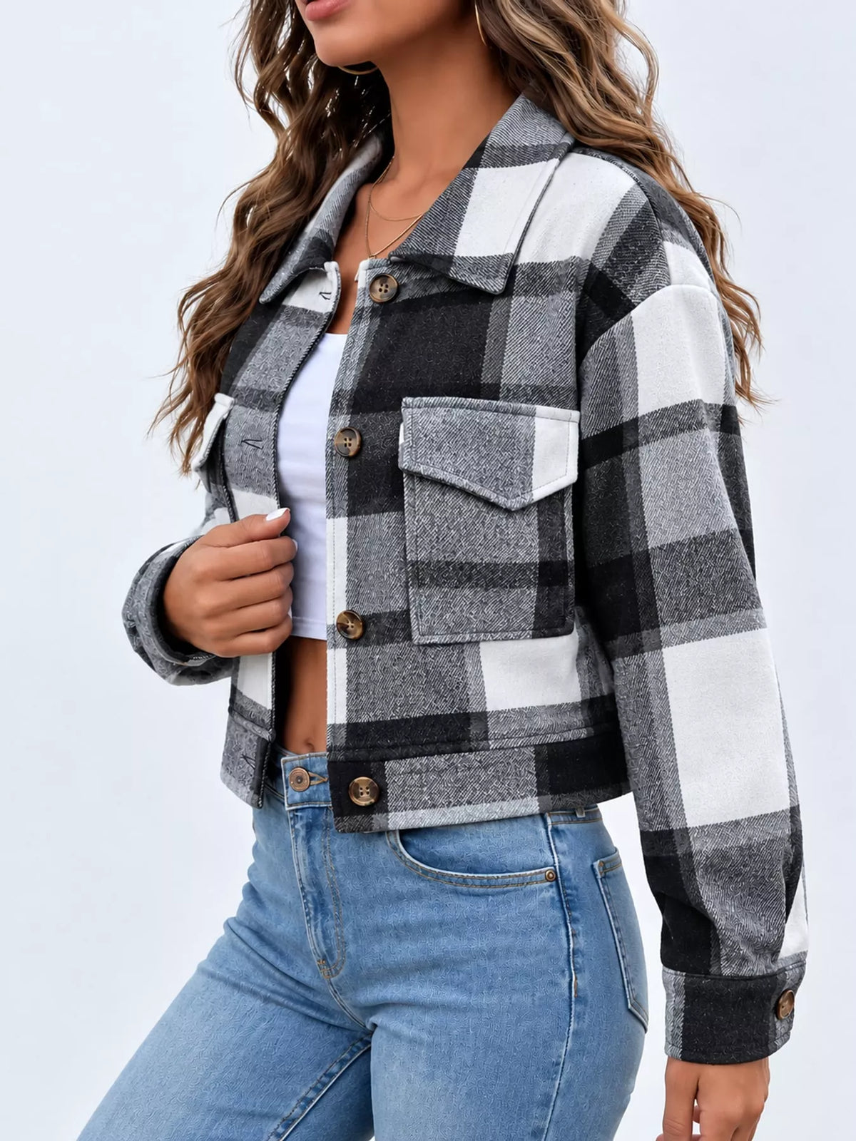 Gray color-block plaid cropped jacket with flap chest pockets, side view.