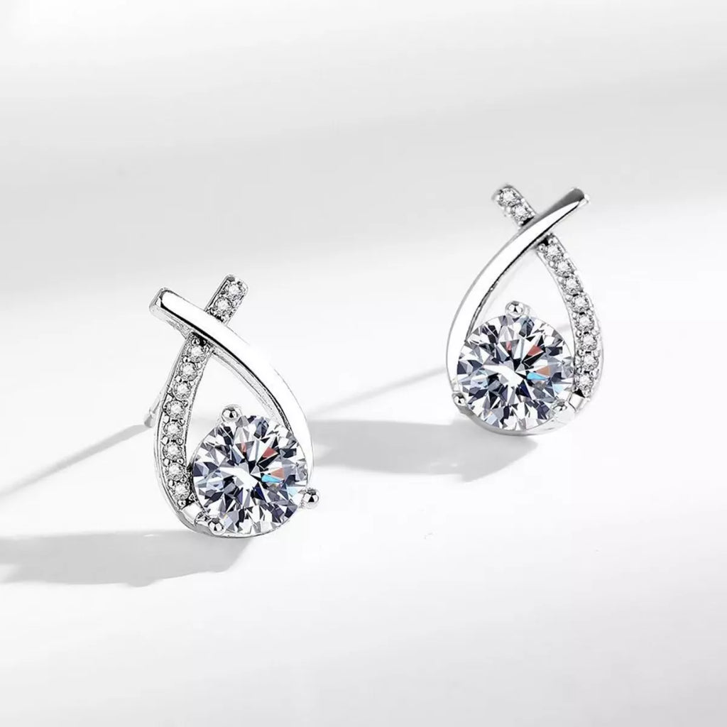 Silver-tone open teardrop earrings with round clear stones — detail view