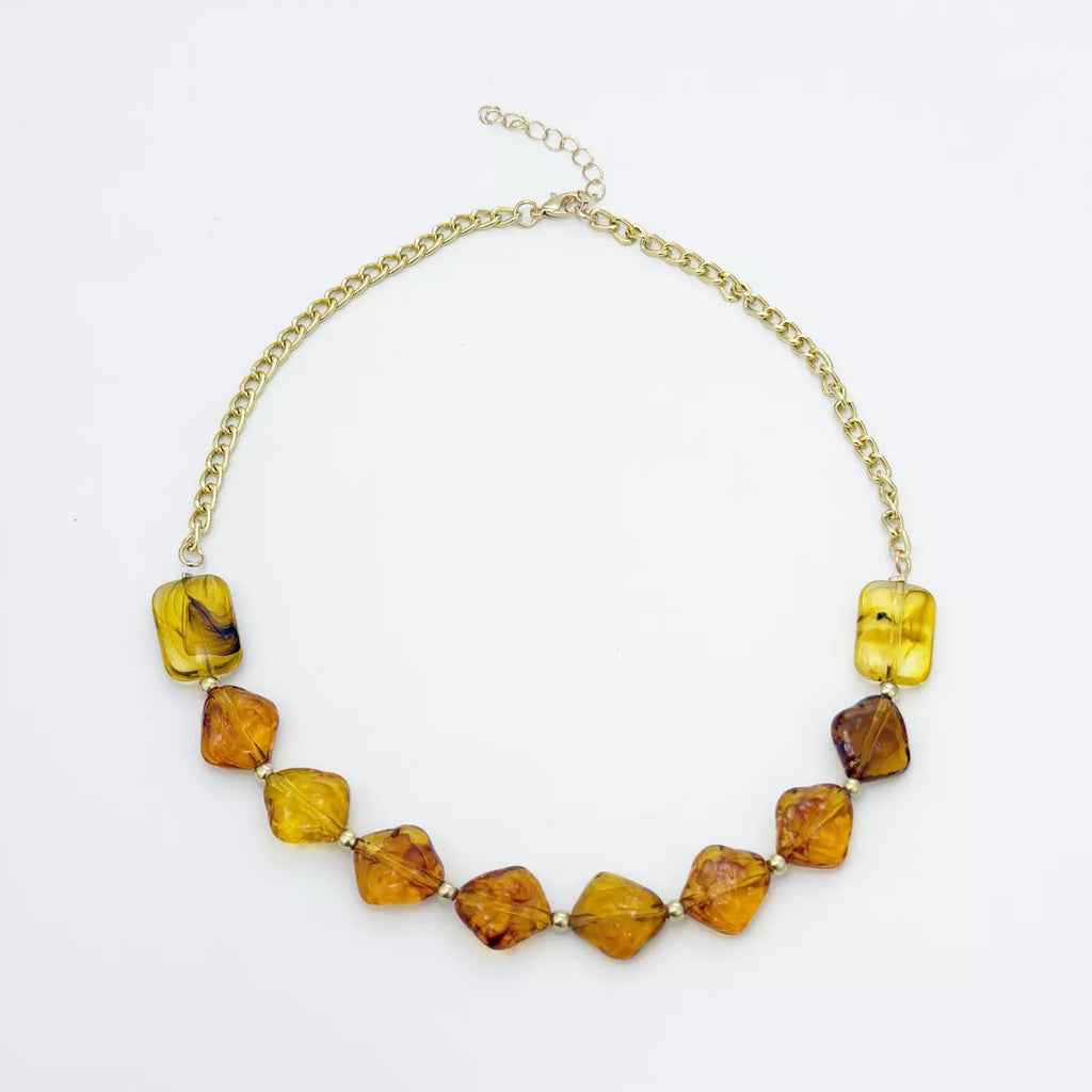 Gold-tone necklace with angular amber-colored beads