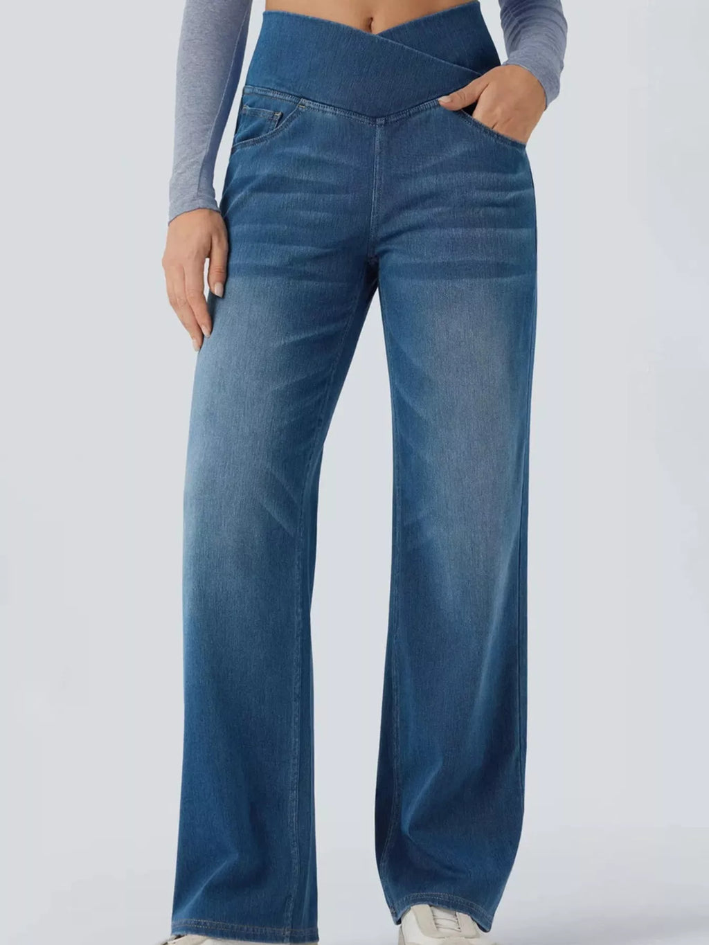Light blue high-waisted crossover waistband straight-leg jeans — detail view