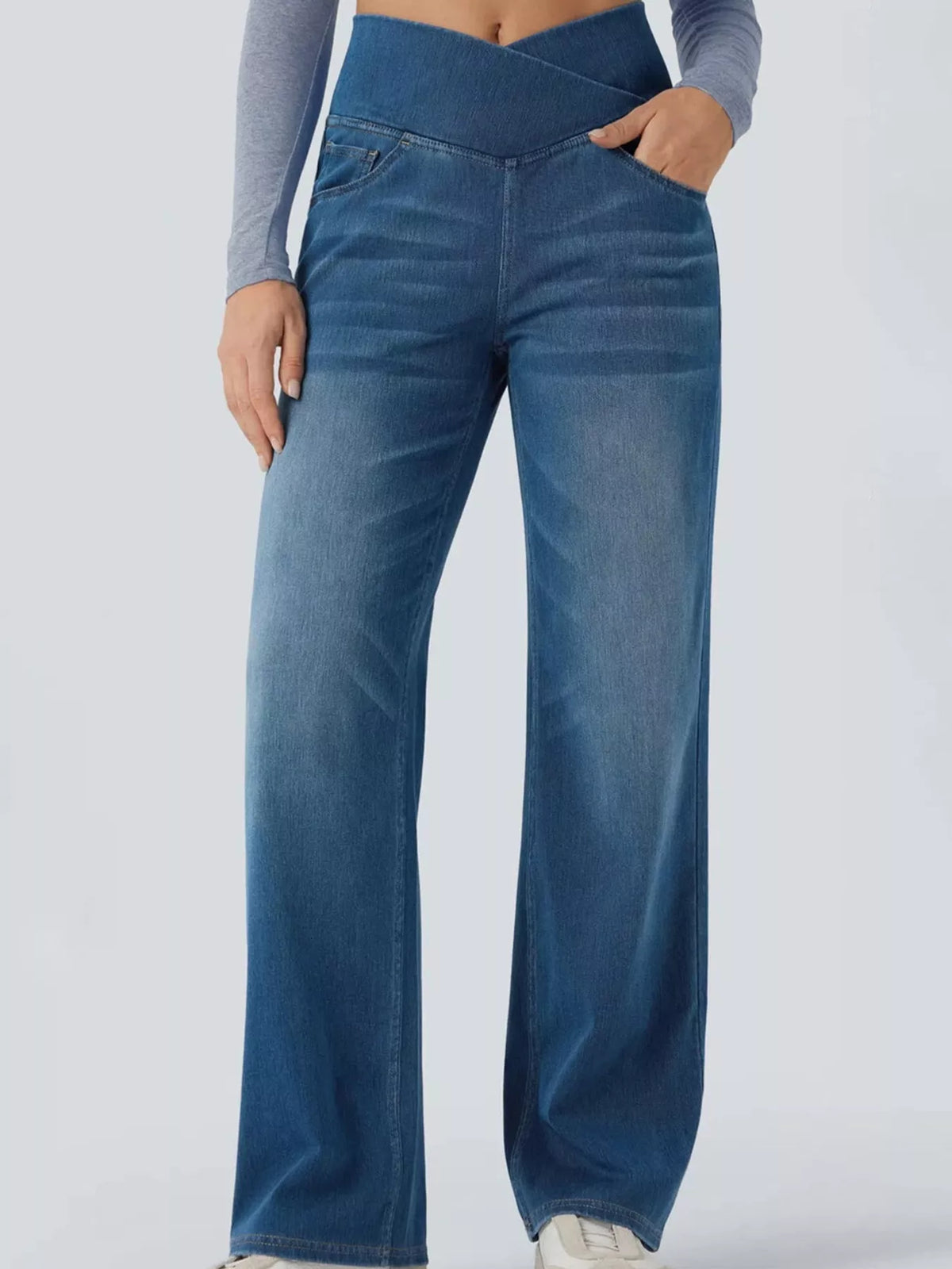 Light blue high-waisted crossover waistband straight-leg jeans — detail view