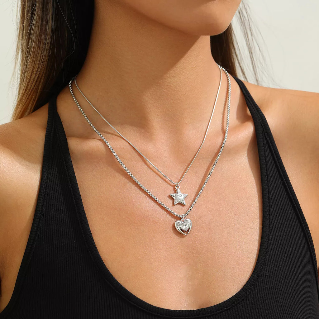 Layered silver-tone star and heart pendant necklaces