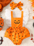 Orange pumpkin-face baby romper with black polka dots, white eyelet ruffles and matching bow headband.