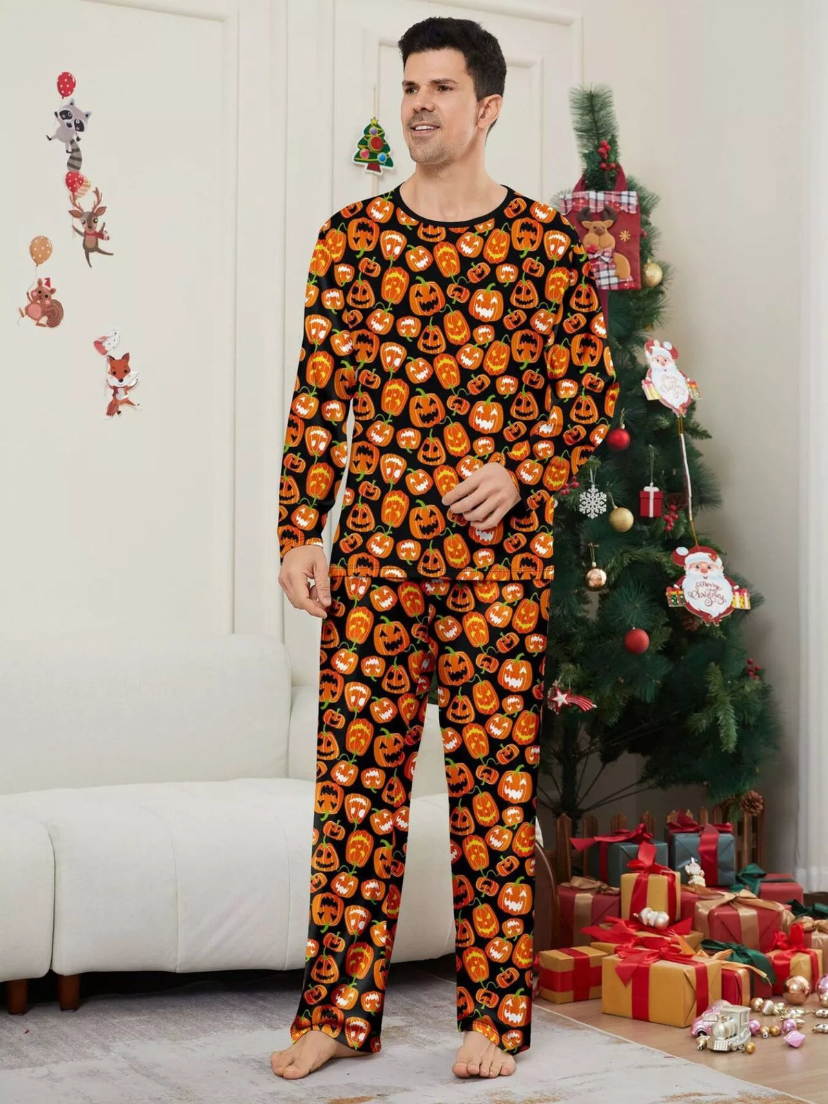 Man modeling the black pajamas with orange pumpkin faces.