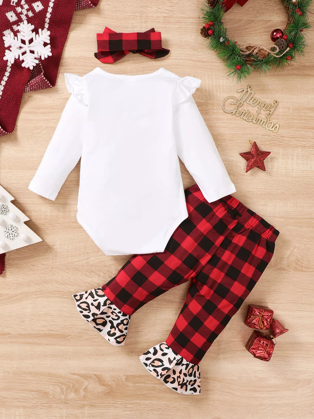 Back flat lay of the white bodysuit, plaid pants with leopard cuffs and plaid bow headband.