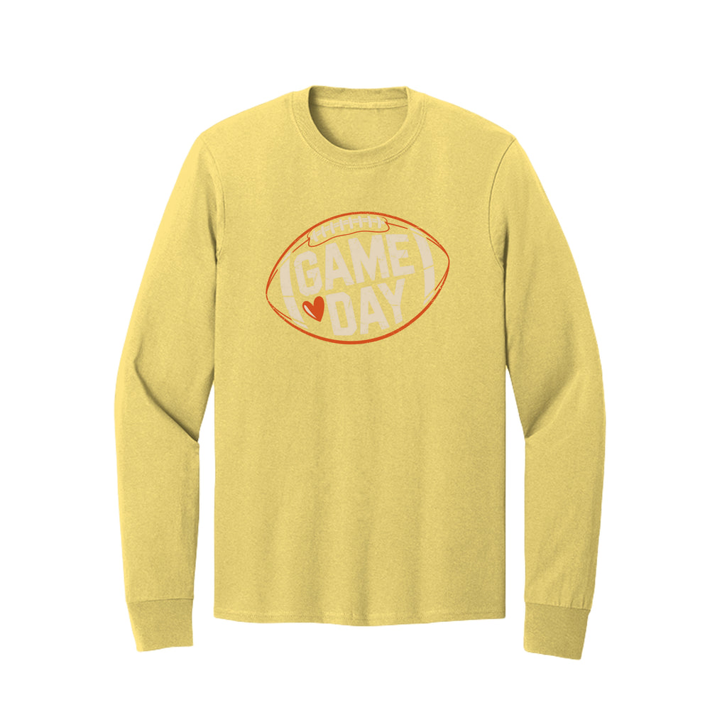 Front view of a yellow long-sleeve T-shirt with cream Game Day lettering and a heart inside an orange football outline.