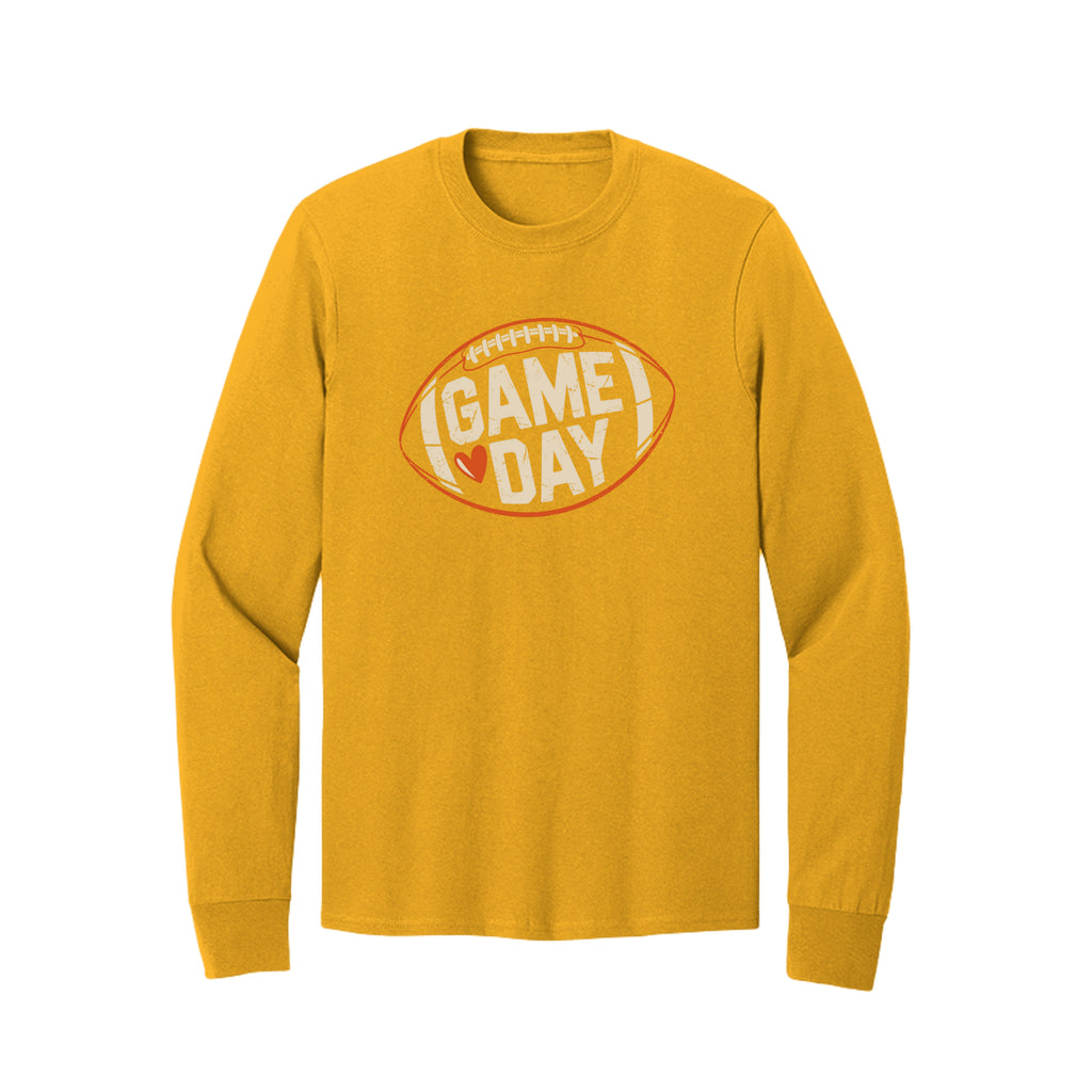 Front view of a gold long-sleeve T-shirt with cream Game Day lettering and a heart inside an orange football outline.