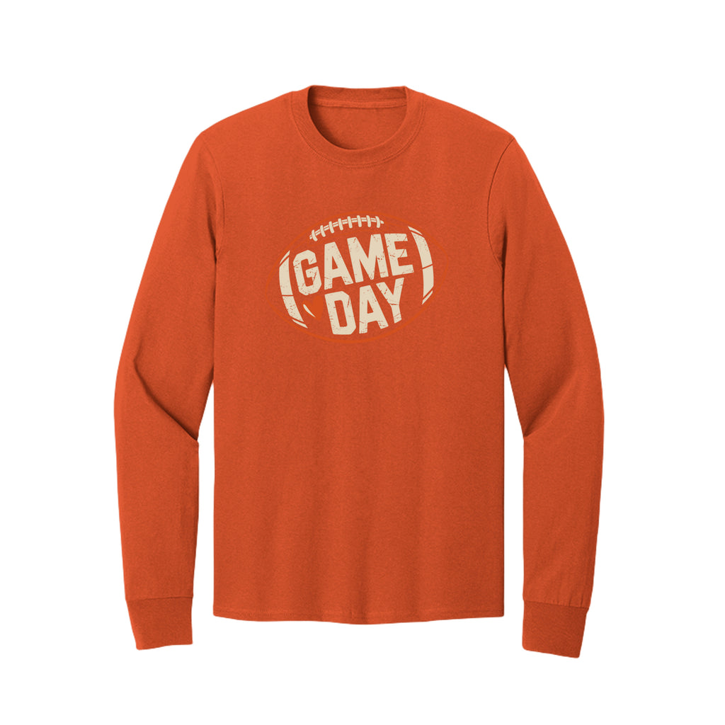 Front view of a orange long-sleeve T-shirt with cream Game Day lettering and a heart inside an orange football outline.