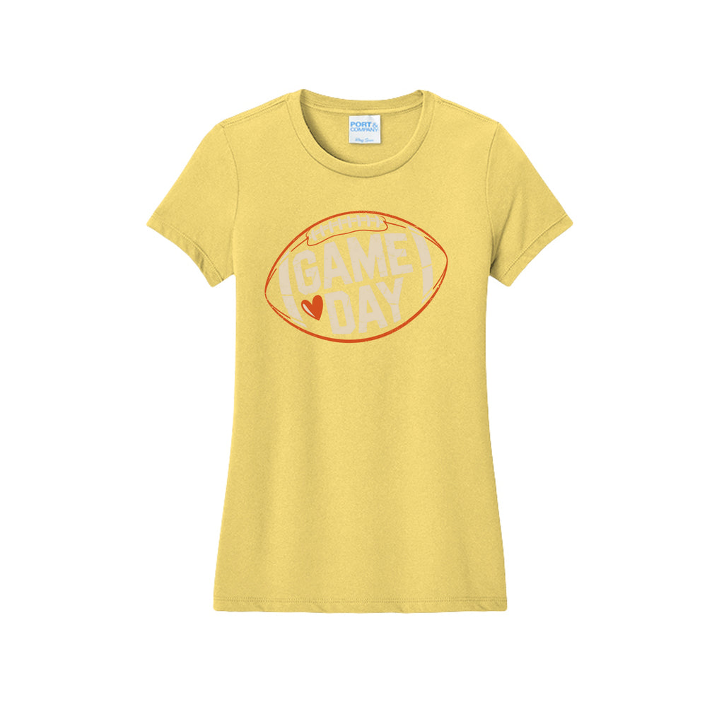 Front view of a yellow fitted short-sleeve T-shirt with cream Game Day lettering and a heart inside an orange football outline.