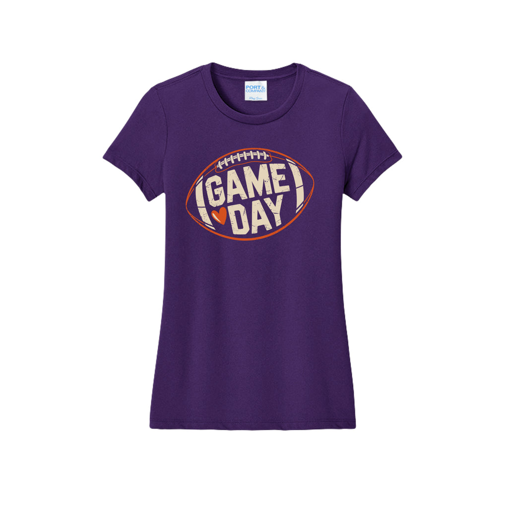 Front view of a purple fitted short-sleeve T-shirt with cream Game Day lettering and a heart inside an orange football outline.
