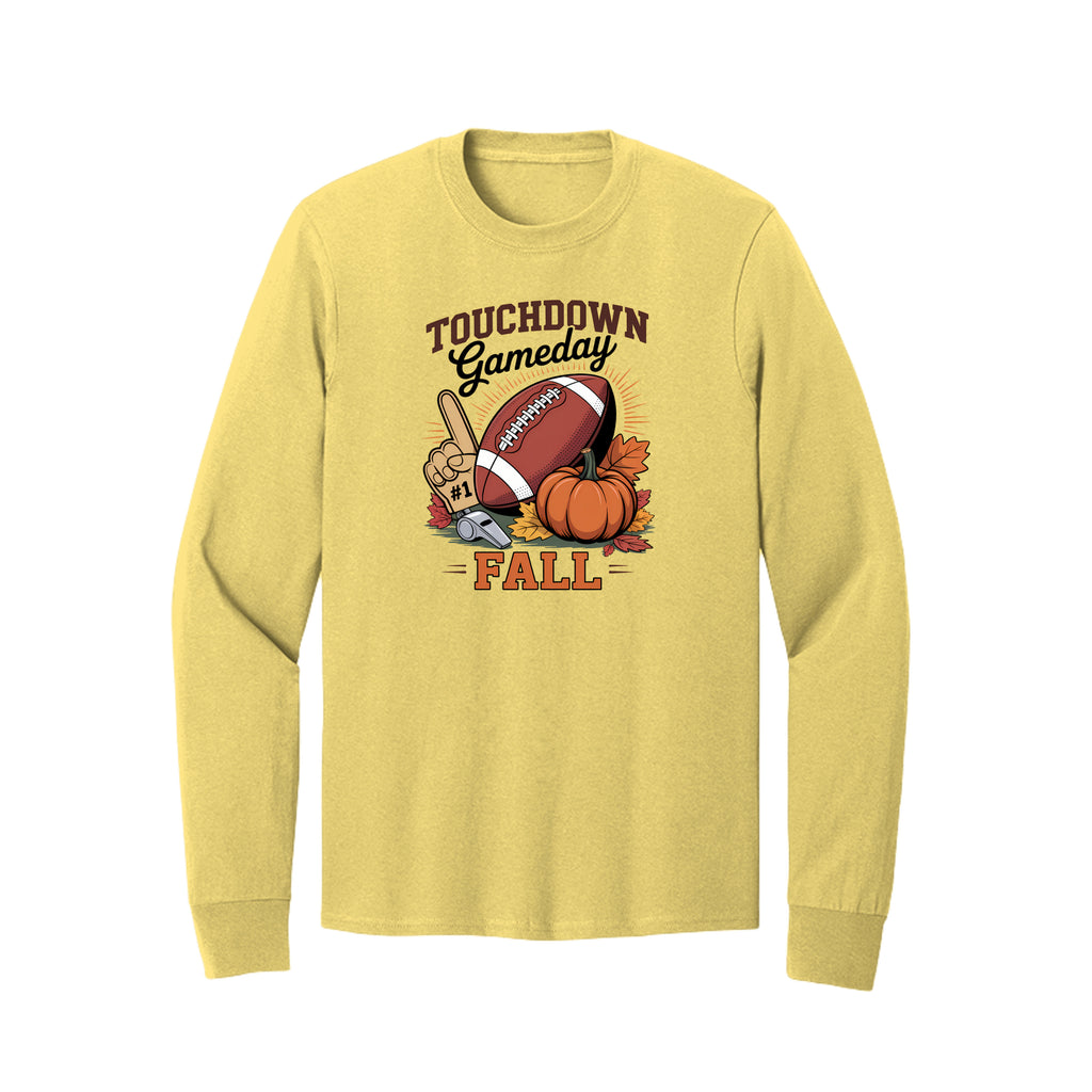 Front view of a yellow long-sleeve T-shirt with Touchdown Gameday Fall lettering with a football, pumpkin, foam finger, whistle, and autumn leaves.