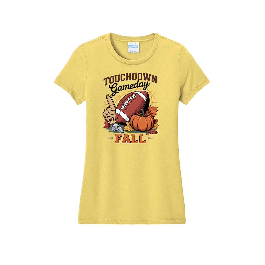 Front view of a yellow fitted short-sleeve T-shirt with Touchdown Gameday Fall lettering with a football, pumpkin, foam finger, whistle, and autumn leaves.