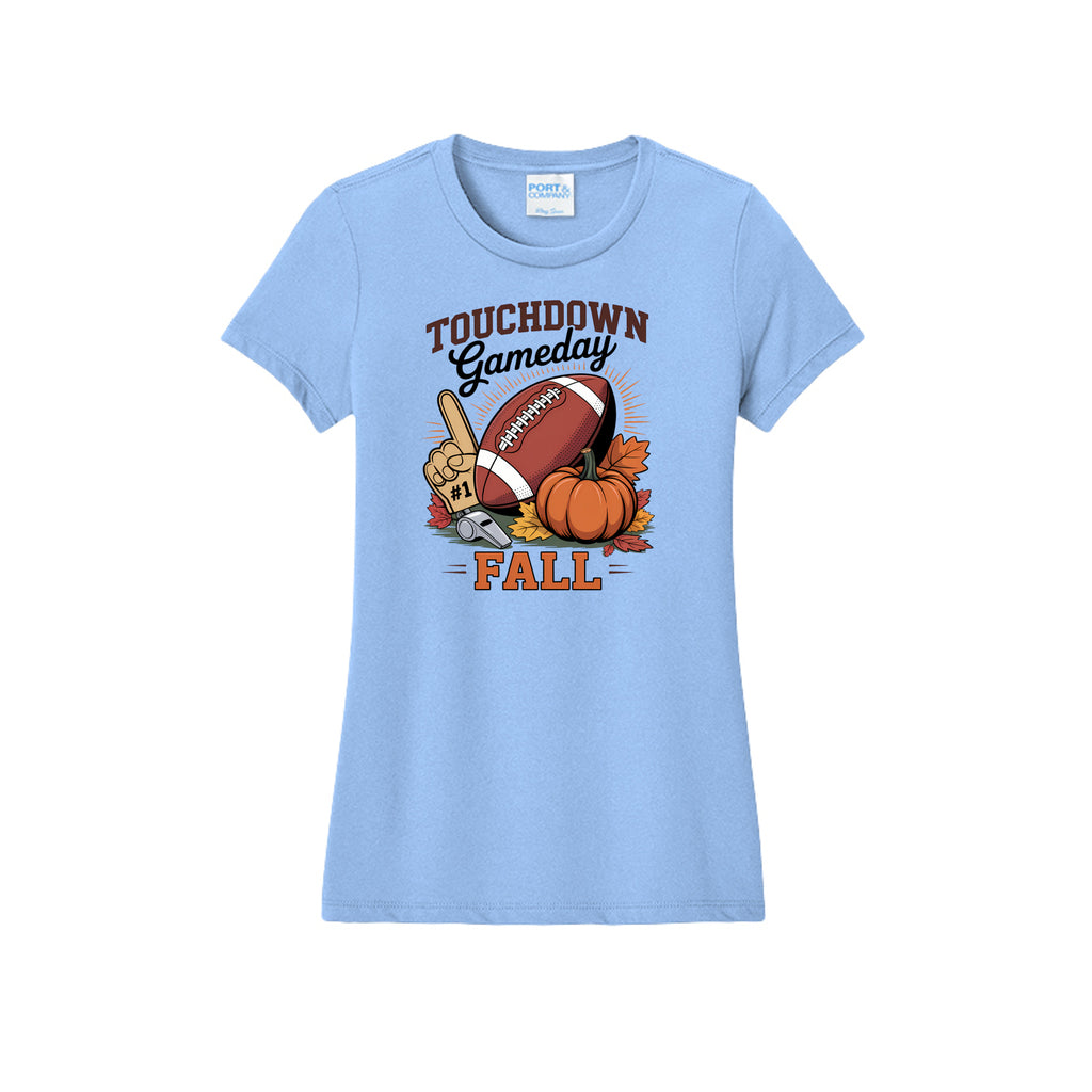 Front view of a light blue fitted short-sleeve T-shirt with Touchdown Gameday Fall lettering with a football, pumpkin, foam finger, whistle, and autumn leaves.