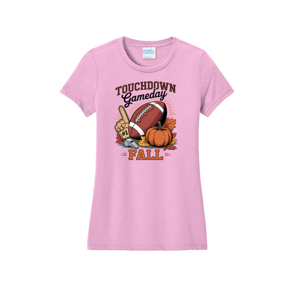 Front view of a light pink fitted short-sleeve T-shirt with Touchdown Gameday Fall lettering with a football, pumpkin, foam finger, whistle, and autumn leaves.