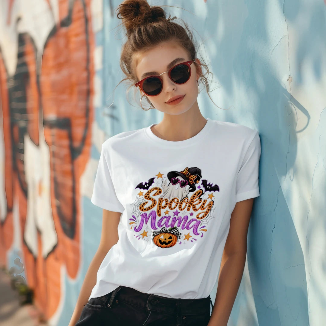 Person in sunglasses wearing a white Spooky Mama graphic T-shirt.