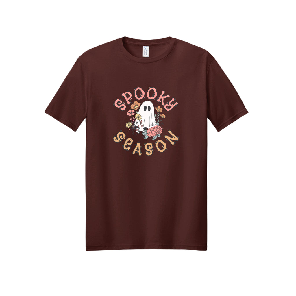 Front view of a brown short-sleeve T-shirt showing Spooky Season lettering around a white ghost surrounded by pink, orange, and yellow flowers.