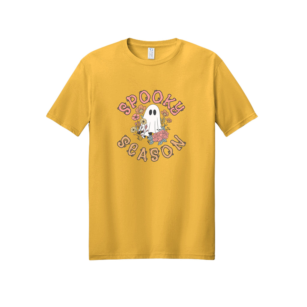 Front view of a gold short-sleeve T-shirt showing Spooky Season lettering around a white ghost surrounded by pink, orange, and yellow flowers.