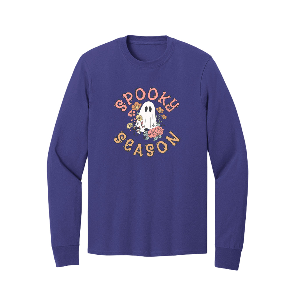 Front view of a purple long-sleeve T-shirt showing Spooky Season lettering around a white ghost surrounded by pink, orange, and yellow flowers.