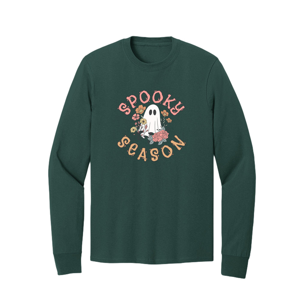 Front view of a green long-sleeve T-shirt showing Spooky Season lettering around a white ghost surrounded by pink, orange, and yellow flowers.