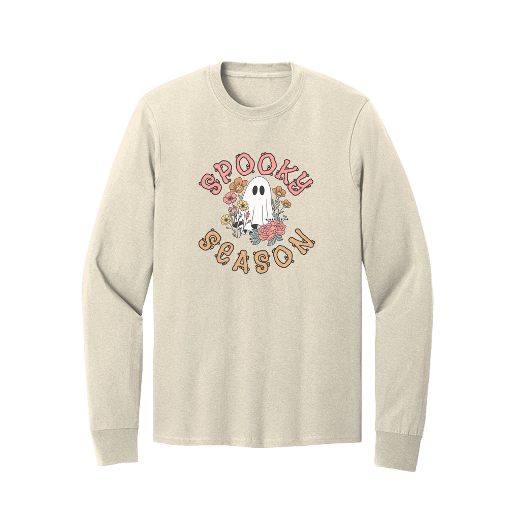 Front view of a cream long-sleeve T-shirt showing Spooky Season lettering around a white ghost surrounded by pink, orange, and yellow flowers.