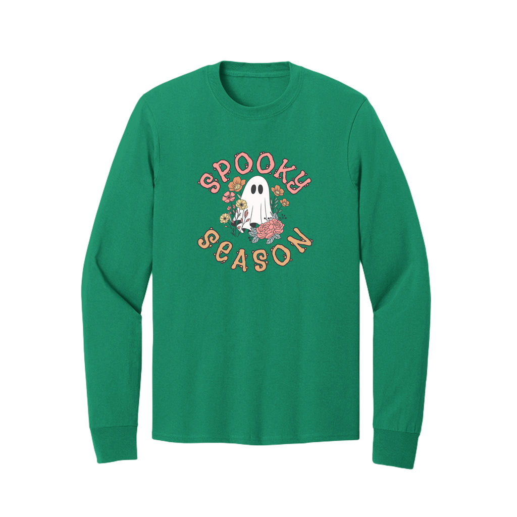 Front view of a green long-sleeve T-shirt showing Spooky Season lettering around a white ghost surrounded by pink, orange, and yellow flowers.