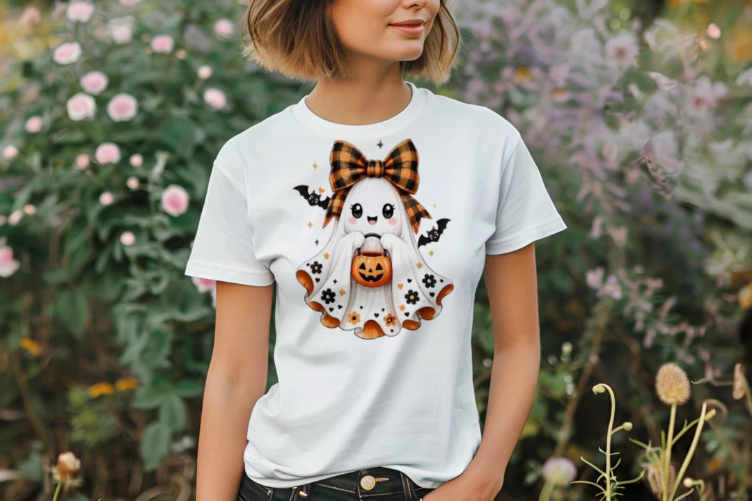 Person wearing a white Sweet Ghost Halloween graphic T-shirt.