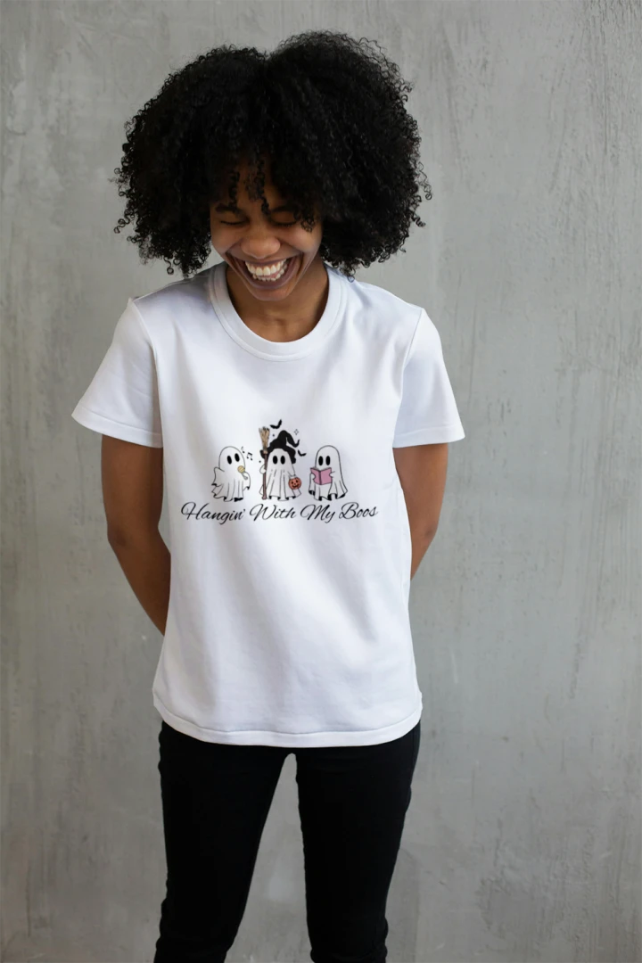 Person wearing a white Hangin With My Boos graphic T-shirt.