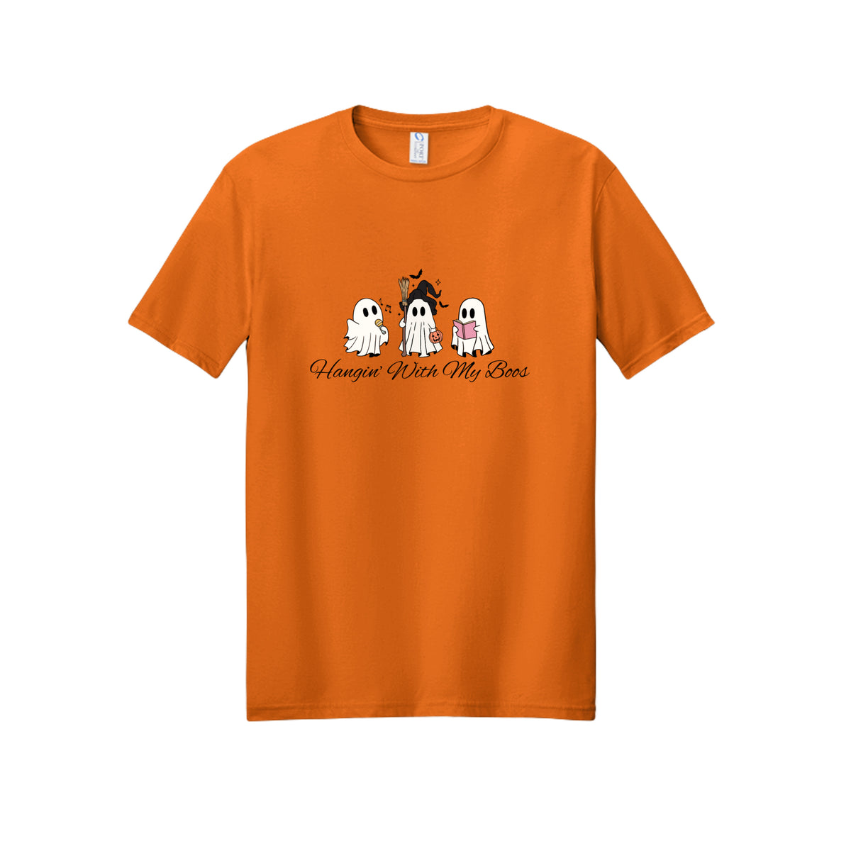 Front view of a orange short-sleeve T-shirt showing three ghosts with a microphone, witch hat and broom, pumpkin bucket, and pink book.