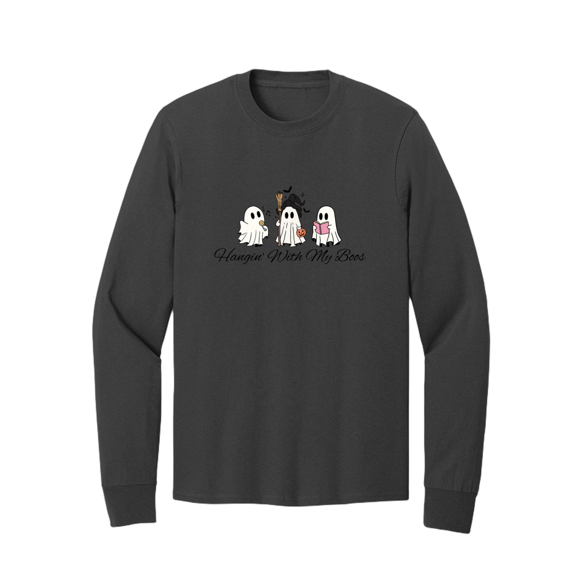 Front view of a black long-sleeve T-shirt showing three ghosts with a microphone, witch hat and broom, pumpkin bucket, and pink book.